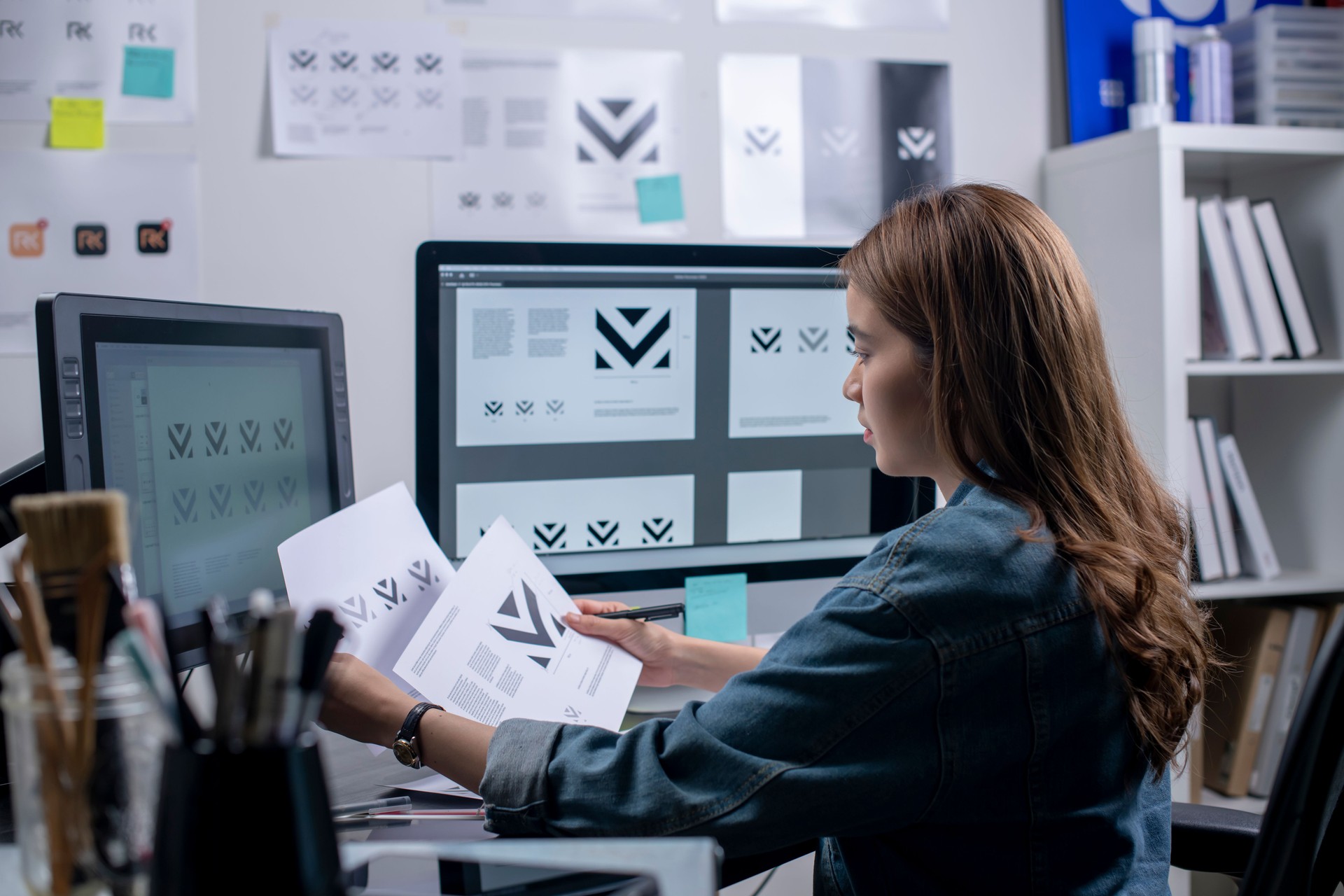 Woman graphic designer working in office.